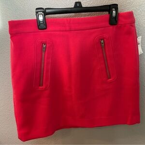 Mini shirt with zippered pockets.